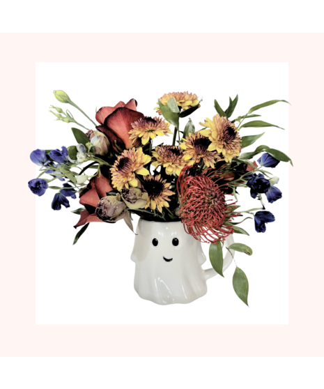 Fall flowers in a ghost cup vase