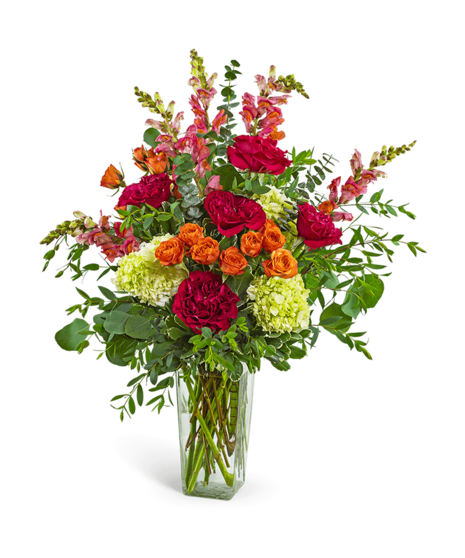 Peoria Sunset Blooms floral arrangement with roses, snapdragons, hydrangea, and greenery in a clear glass vase – available for delivery in Peoria, IL
